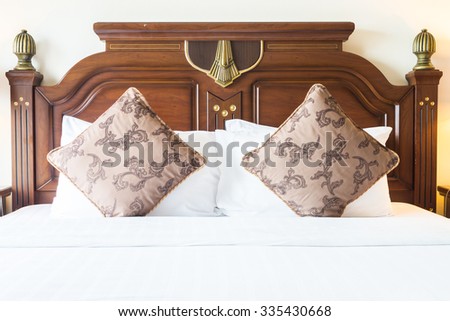 Pillow on bed with light lamp decoration in bedroom interior