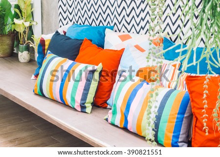 Patio outdoor deck with colorful pillow on chair decoration exterior of home - Vintage light filter