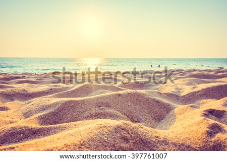 Beautiful beach sand and sea at sunset times with copy space for background - Vintage Filter and Boost up color Processing