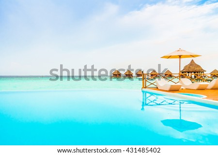 Outdoor swimming pool in Beautiful tropical Maldives island resort with beach and sea for nature holiday vacation background concept - Boost up color Processing