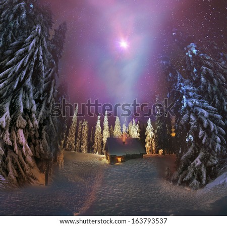 Traveling through the winter mountains beauty, bold and romantic people can find shelter in the hunting huts, Glued to the panorama at a slow. The Milky Way as smoke rises over the frozen nature...