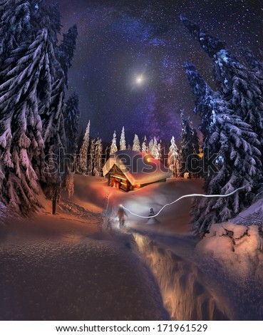 Traveling through the winter mountains, bold and romantic people can find shelter in the hunting huts, Glued to the panorama at a slow. The Milky Way galaxy , as smoke rises over the frozen nature...