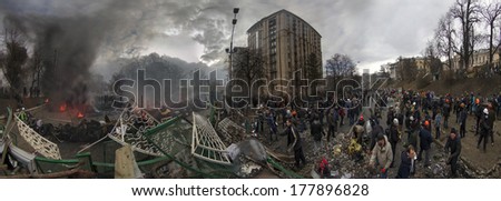 Kiev, Ukraine - February 20, 2014: Freed from government troops Evromaydan. View from the barricades. The smoke protesters hiding from snipers. Kiev, the capital defenders