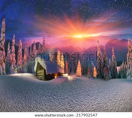 Climbing to tourist wild alpine mountain to an abandoned cabin-in order to illuminate the snow-covered spruce canopy during moonrise, moonset, to see the first star of Christmas in the Carpathians
