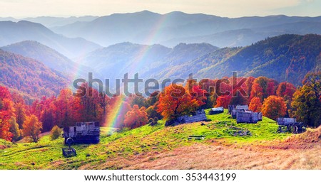 shepherds leave the pasture before the first snow and frost deserted house asylum sheds remain until next season, against the background of gold and red peaks of the Carpathians