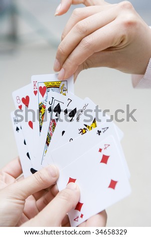 Woman\'s hands picking the card