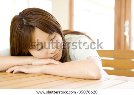 A beautiful Japanese woman taking a nap