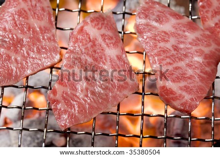 Close-up shot of slices of fresh bone-less short rib on the grill