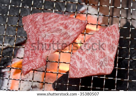 Close-up shot of slices of fresh bone-less short rib on the grill
