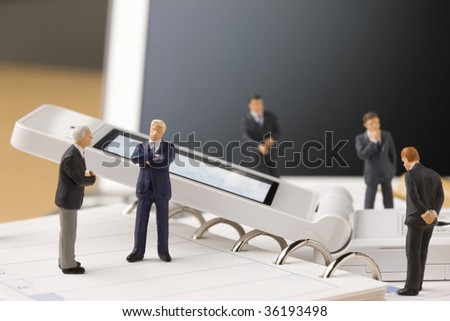 Five models of business man looking at white mobile