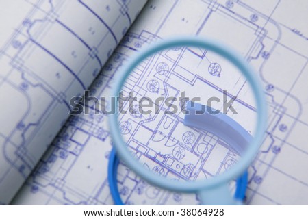 Magnifying glass on the drawing sheet.