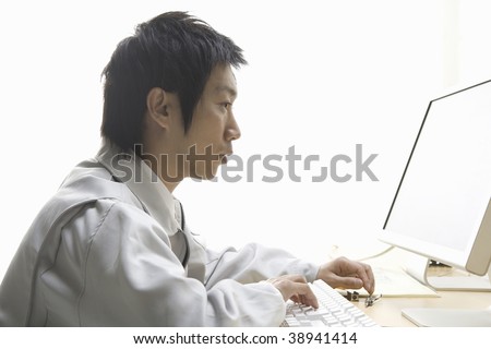 Workman operating a computer in the office