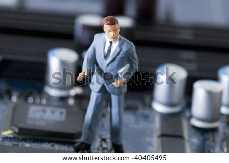 Doll of the businessman who pauses in the electronic machine.