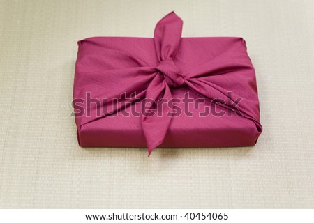 Gift wrapped with a silk wrapping cloth.
