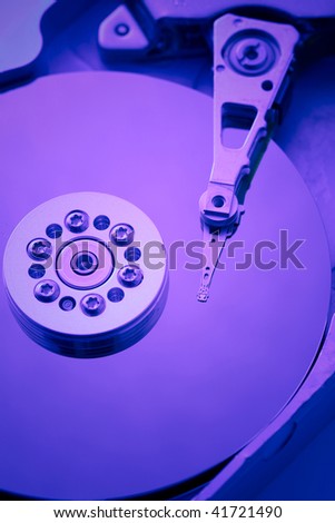 Close-up inside of computer hard drive in purple