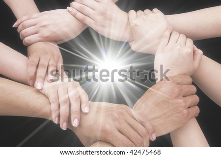 Hands and arms making circle around shine