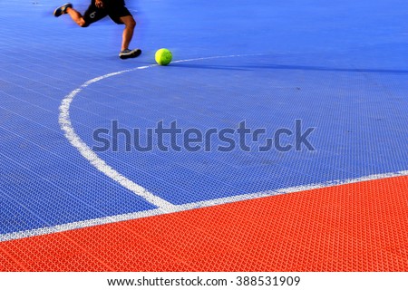 man kicking football on ground futsal. futsal plastic court flooring tiles texture floor