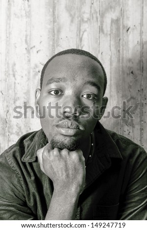 Portrait of an African American hold his chin with fist