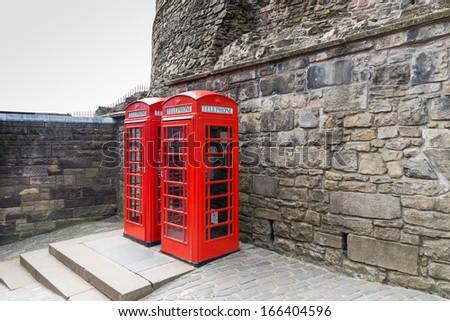 Classic red British telephone box in Edinburgh, Scotland, UK.