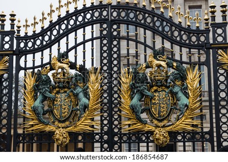 LONDON - DECEMBER 31: Buckingham palace gates on December 31, 2013 in London UK. Buckingham palace is the official residence of Queen Elizabeth II and one of the major tourist destinations UK.