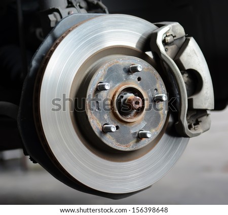 Front Disc Brakes with caliper on car to remove the wheel.