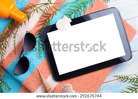 beach background with a blank tablet