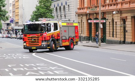 SYDNEY - AUSTRALIA - APR 22: Sydney Fire service, Fire Engine moving from a fire station on April 22, 2012. Sydney, Australia.