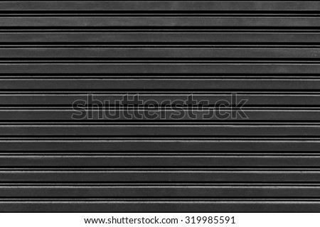 old steel rolling shutter background (black and white tone color)