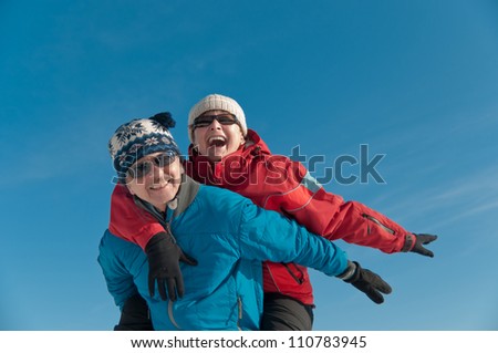 Active senior couple  - smiling mature man and woman outdoor in winter