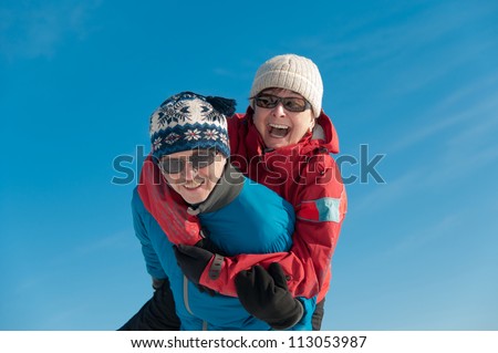 Active senior couple  - smiling mature man and woman outdoor in winter