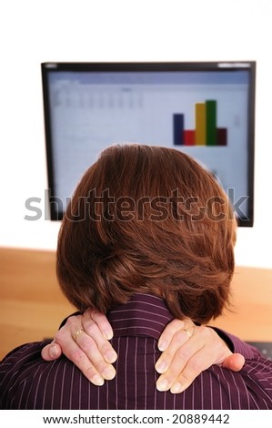 Business woman with neck pain holds her neck with both hands
