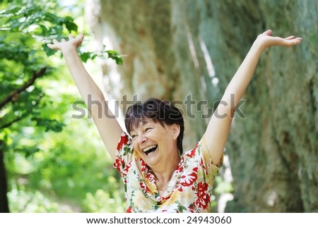 Senior woman enjoys life outdoors
