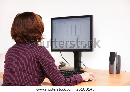 Business person works at table with computer
