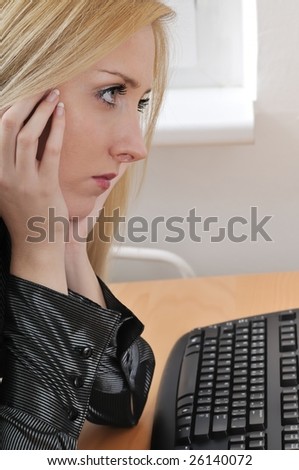 Young business woman with depression - head in hands