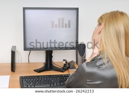 Business woman with neck pain sitting at computer