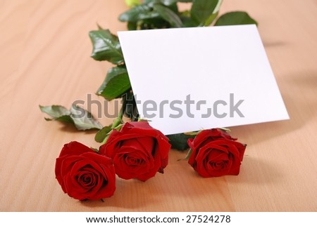 Love message on table - red roses with envelope