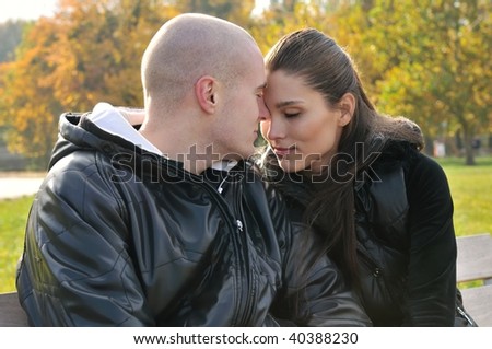 Young couple in love outdoors - gentle emotions