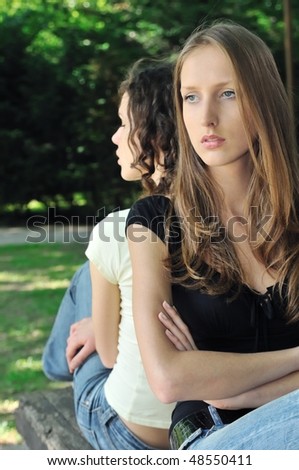 stock photo : Friends outdoors series - two teenage girls are in conflick 