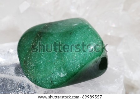 Aventurine green gem energized on druze of quartz crystals. This gem is used as a jewel stone and also in alternative medicine and esoterics (connected with heart chakra).