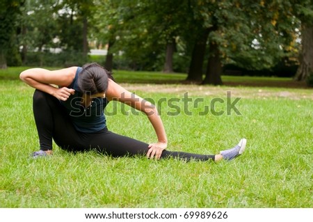 Woman stretching muscles before jogging