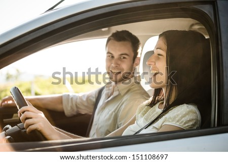 Happy time together - couple in car singing song