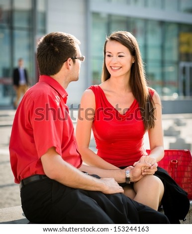 Colleagues - young business people having conversation outdoor in street