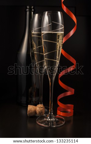 Champagne glasses and cork