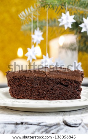 Danish christmas cake and traditional danish christmas paper stars on fir branch