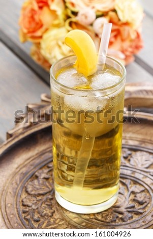 Peach drink on wooden tray