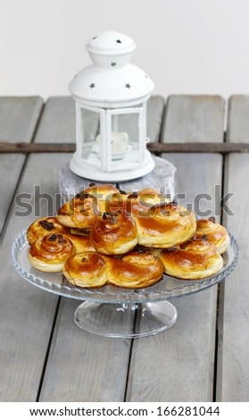 Traditional swedish buns on wooden table.