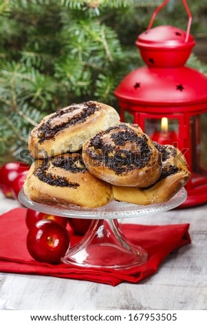 Poppy seed buns on cake stand. Christmas eve setting, traditional arrangement.