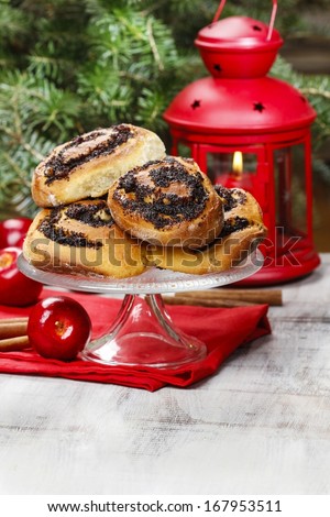 Poppy seed buns on cake stand. Christmas eve setting, traditional arrangement.