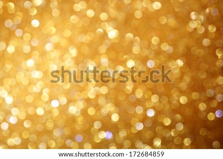 Gold Glittering Christmas Lights. Blurred Abstract Background