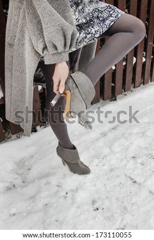 Woman wearing high heels in winter